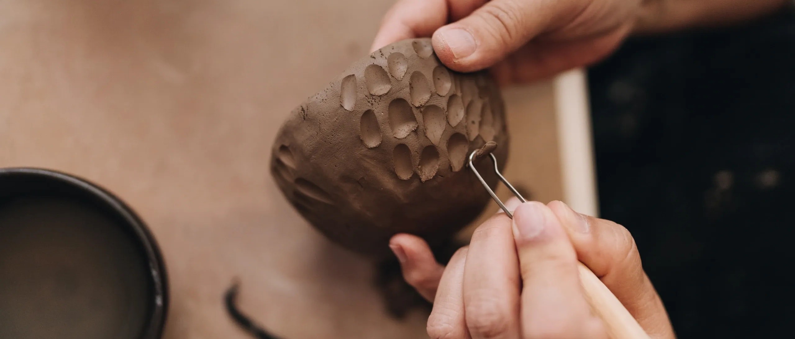 Artisan crafting terracotta jewellery